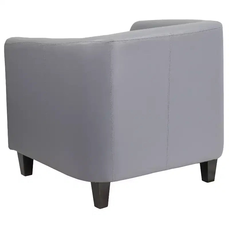 Fauteuil de salon en cuir avec accoudoirs inclinés